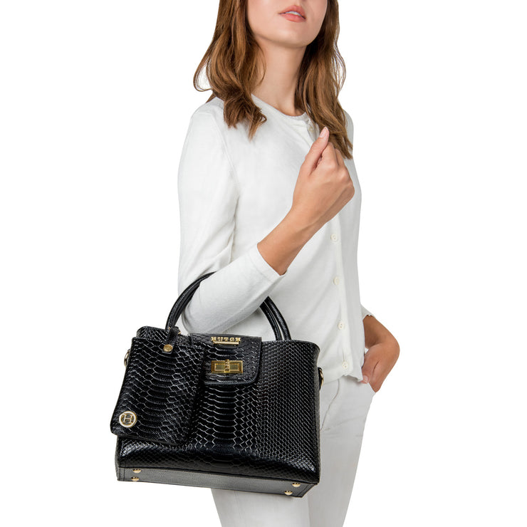 Model holding HUTCH Black Python Embossed Leather Satchel Handbag